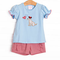  This set features a blue puff sleeve top with a puppy with balloons appliques. Coordinating red gingham ruffle shorts to match. 
