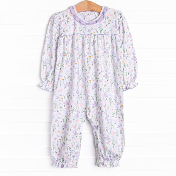 This romper features a purple floral print, a purple ruffle collar and the softest knit material.