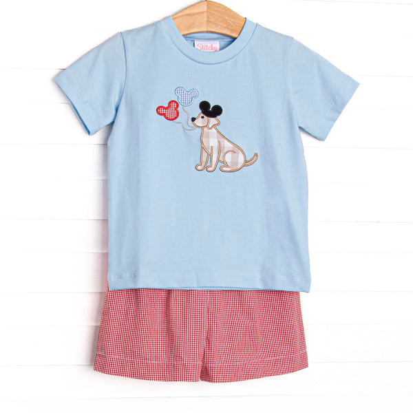  This set features a blue short sleeve top with a puppy with balloons appliques. Coordinating red gingham ruffle shorts to match. 