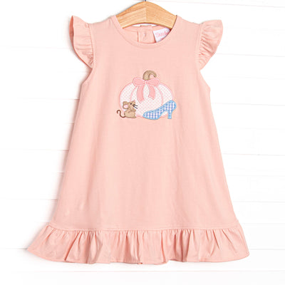 This dress features a pink knit material, flutter sleeves, and a pumpkin carriage applique.