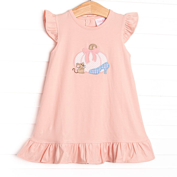 This dress features a pink knit material, flutter sleeves, and a pumpkin carriage applique.