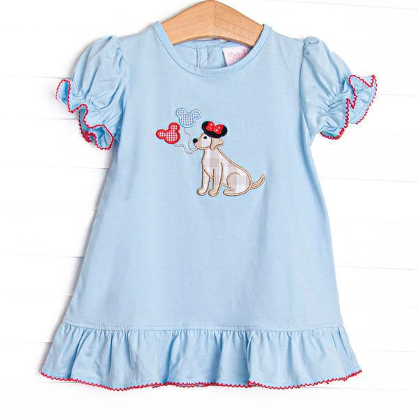 This dress features a blue knit material, flutter sleeves, and puppy with balloons appliques.