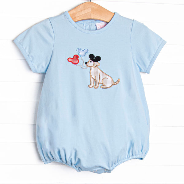 This bubble features a blue knit material, short&nbsp; sleeves, and puppy with balloons appliques.
