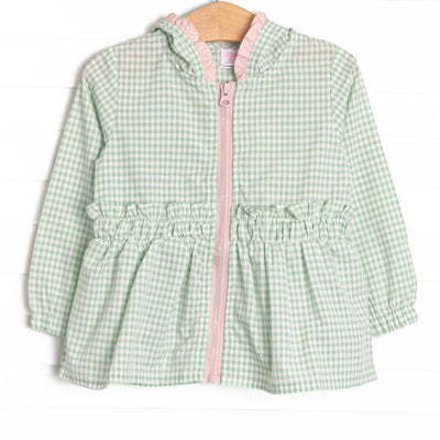  This coat features a green gingham, pink ruffles, and a cozy hood. 