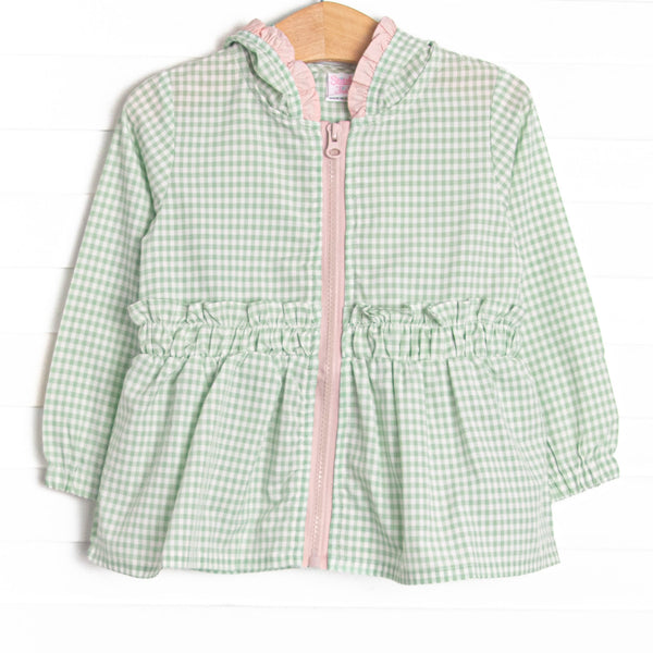  This coat features a green gingham, pink ruffles, and a cozy hood. 