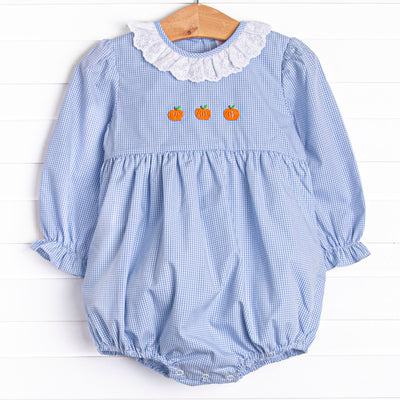  This bubble features a blue gingham print, eyelet lace ruffle collar, and pumpkin embroideries. 