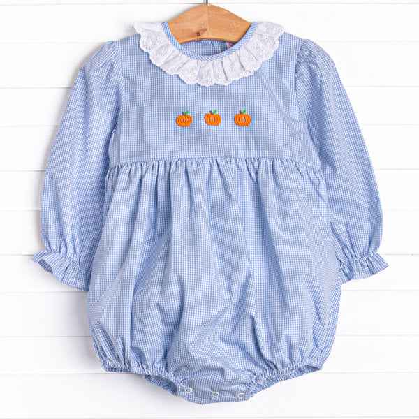  This bubble features a blue gingham print, eyelet lace ruffle collar, and pumpkin embroideries. 