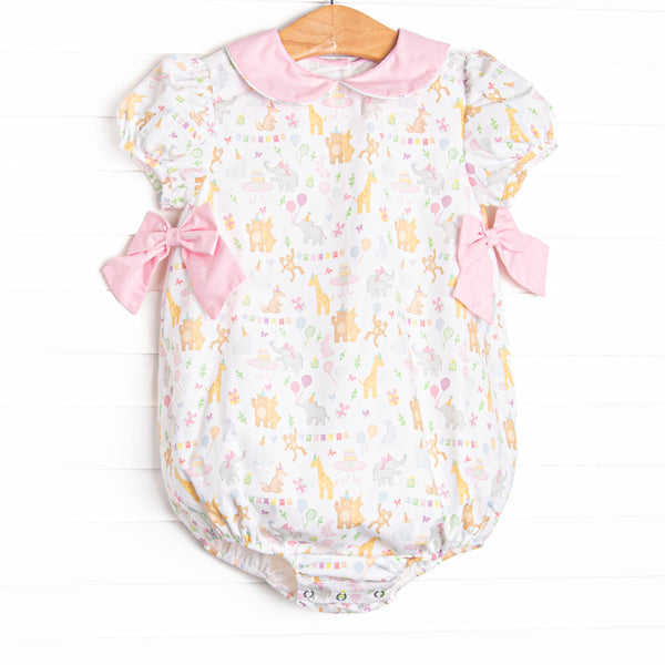  This bubble features a party animal print fabric, a pink Peter Pan collar, and short puff sleeves. 