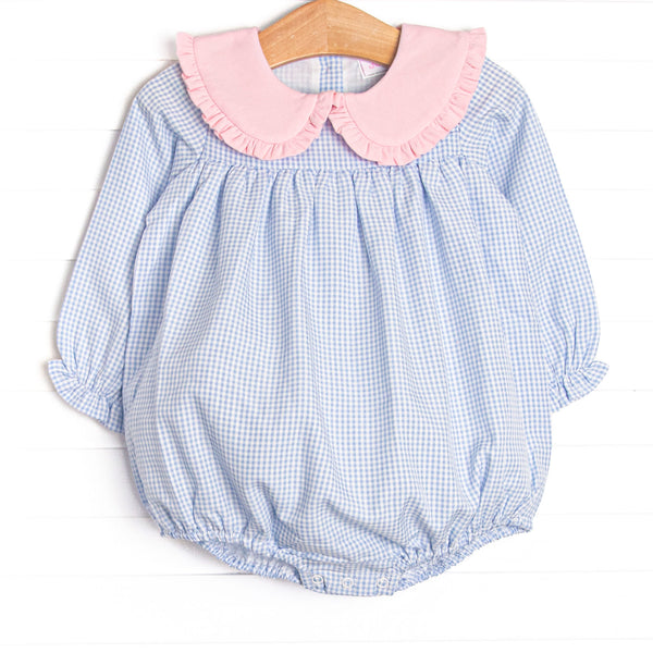  This bubble features light blue gingham fabric, a pink ruffle trimmed Peter Pan collar, and long sleeves. 