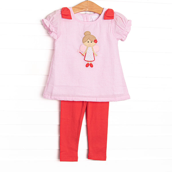 This set features a pink seersucker material, fairy applique, red shoulder bows, and short puff sleeves. Coordinating red leggings to match.