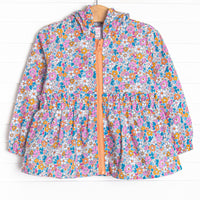 This hooded jacket features an orange floral print, an orange zipper, and ruffle trim.