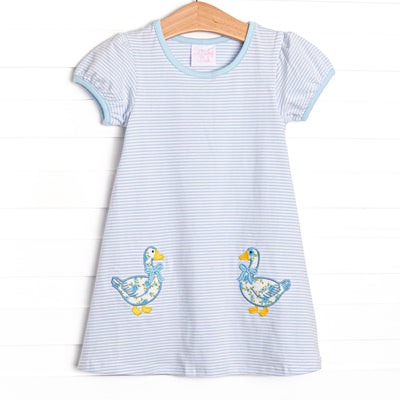 This dress features a blue striped knit fabric, double goose applique, and short puff sleeves.