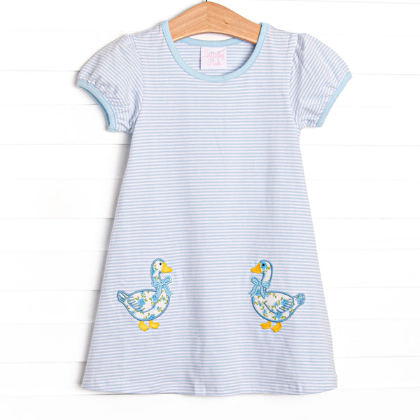 This dress features a blue striped knit fabric, double goose applique, and short puff sleeves.