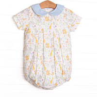  This bubble features a party animal print fabric, a blue Peter Pan collar, and short sleeves. 