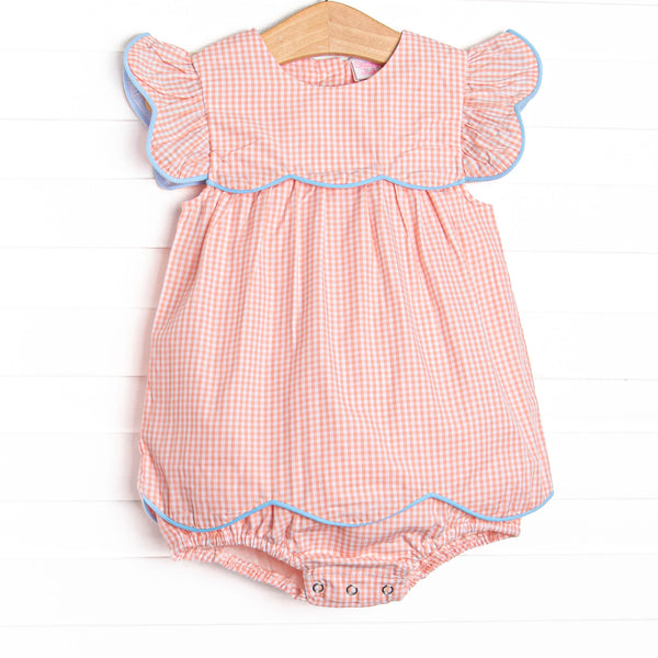  This bubble features a peachy gingham fabric, blue piping, and flutter sleeves. 