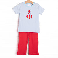 This short sleeve set features blue striped knit fabric, rocket ship applique, and blue neck trim. Coordinating red pants to match.