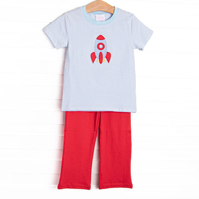 This short sleeve set features blue striped knit fabric, rocket ship applique, and blue neck trim. Coordinating red pants to match.