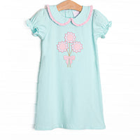  This dress features mint fabric, floral applique, and a mint, pink ruffle trimmed Peter Pan collar. 