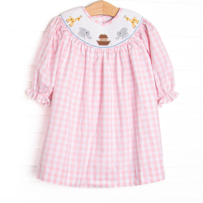 This long sleeve dress is featured in a pink check print with Noah's Ark smocking.