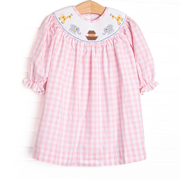 This long sleeve dress is featured in a pink check print with Noah's Ark smocking.