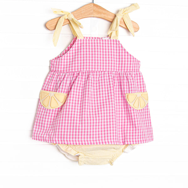 This set features a pink gingham print, yellow seersucker straps, and lemon slice appliques. Coordinating yellow seersucker diaper cover to match.