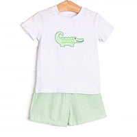 This set features a short sleeve top with flutter sleeves with an alligator applique and coordinating green seersucker shorts to match.