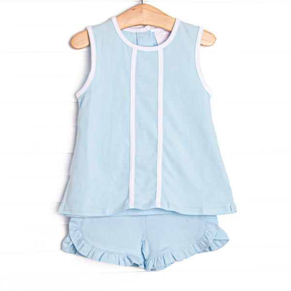  This set features a blue knit material, white trim, and ruffle shorts to match. 