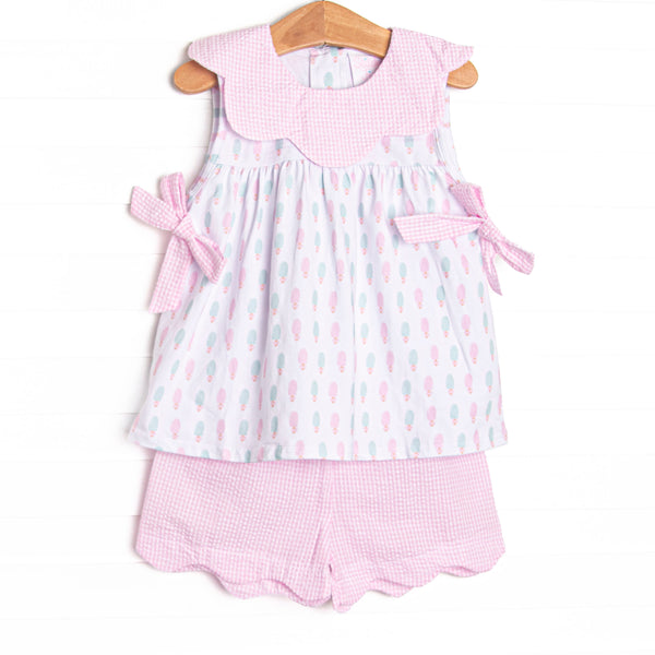 This set features a popsicle print, pink gingham scalloped bib collar, and side bows. Coordinating pink seersucker scalloped shorts to match.