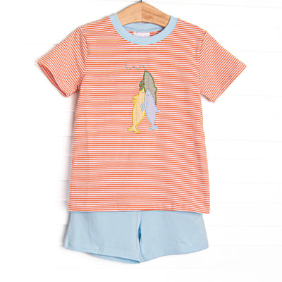 This set features an orange striped top with blue trim and a fishing applique. Coordinating blue shorts to match.