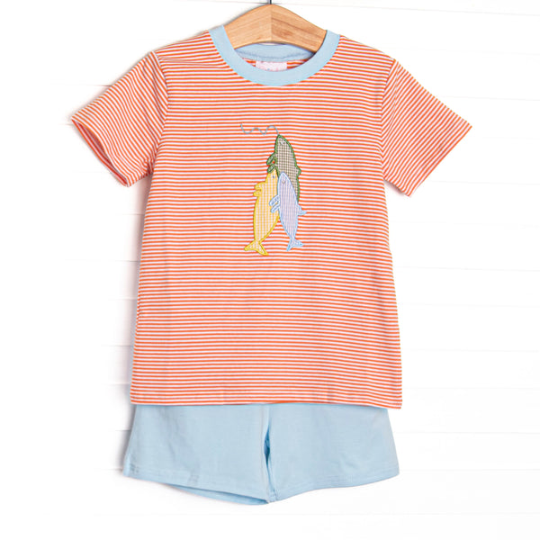 This set features an orange striped top with blue trim and a fishing applique. Coordinating blue shorts to match.