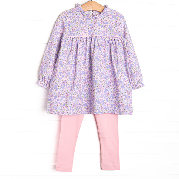This set features a purple floral top with a ruffle neck detail and pink leggings to match.