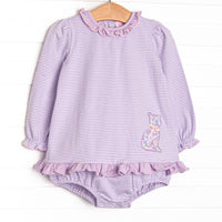 This bubble features a purple striped print, a floral kitten applique and purple ruffle details. 