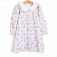  This dress features a pastel gingham fabric with pink florals, long sleeves, and a white eyelet lace trimmed Peter Pan collar. 