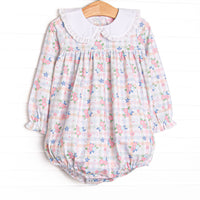  This bubble features a pastel gingham fabric with pink florals, long sleeves, and a white eyelet lace trimmed Peter Pan collar. 