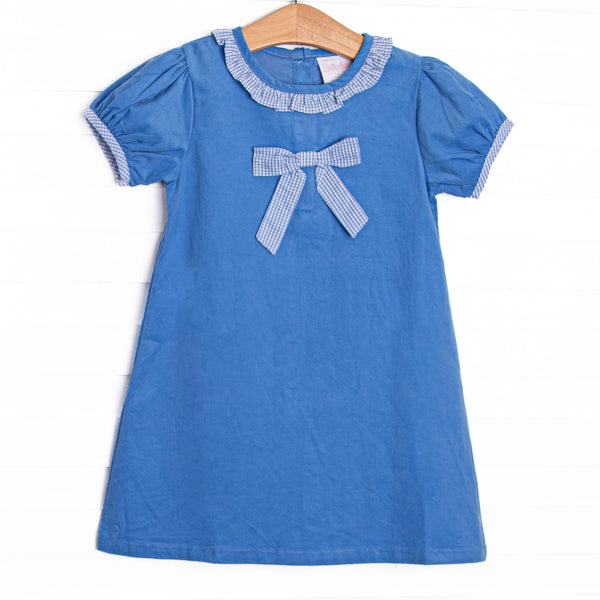 This dress features blue corduroy fabric, short puff sleeves, a light blue gingham ruffle collar, and a light blue gingham pre tied bow.