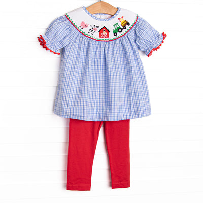 The set features a blue plaid print, puff sleeves, and farm smocking. Coordinating red leggings to match.