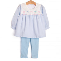 This set features a blue gingham top with a bib collar and bows and flowers appliques. Coordinating blue leggings to match.