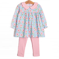 This set features a pink and blue floral printed knit fabric, long sleeves, pink piping, and a pink Peter Pan collar. Coordinating leggings to match.