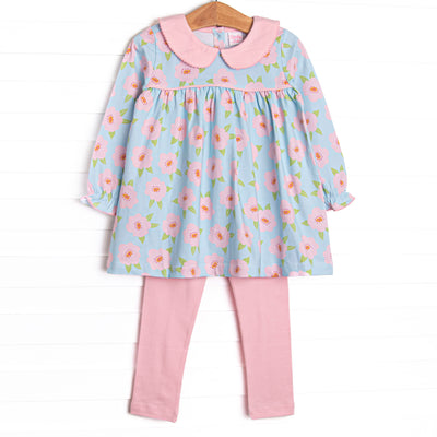 This set features a pink and blue floral printed knit fabric, long sleeves, pink piping, and a pink Peter Pan collar. Coordinating leggings to match.