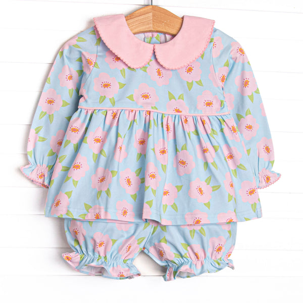 This set features a pink and blue floral printed knit fabric, long sleeves, pink piping, and a pink Peter Pan collar. Coordinating bloomer shorts to match.