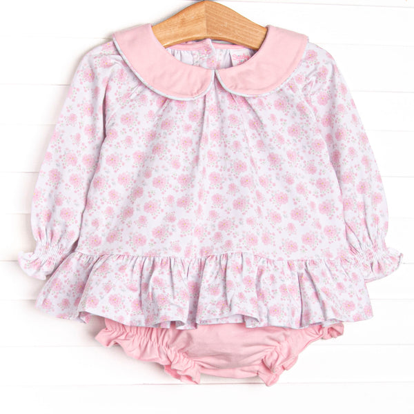  This set features a pink floral print, long sleeves, a ruffle hem, and a pink Peter Pan collar. Coordinating diaper cover to match. 