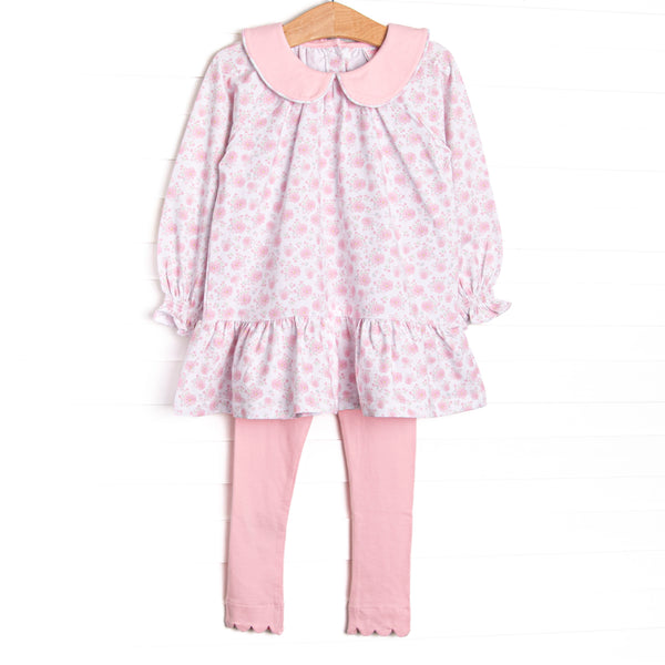  This set features a pink floral print, long sleeves, a ruffle hem, and a pink Peter Pan collar. Coordinating scalloped leggings to match. 