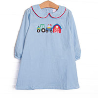  The dress features a blue corduroy material, a peter pan collar with red trim, and a barnyard appliques. 