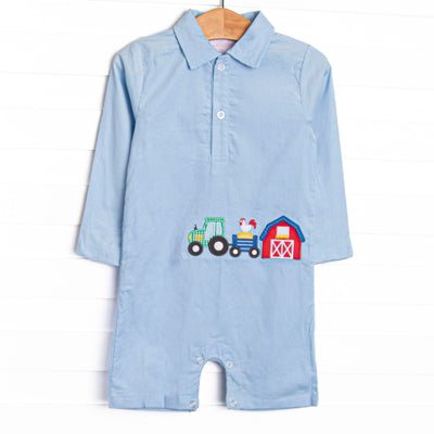  The romper features a blue corduroy material, a polo collar, and&nbsp; barnyard appliques