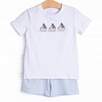  This set features a short sleeve top with a trio of sailboat embroidery and blue striped shorts to match. 