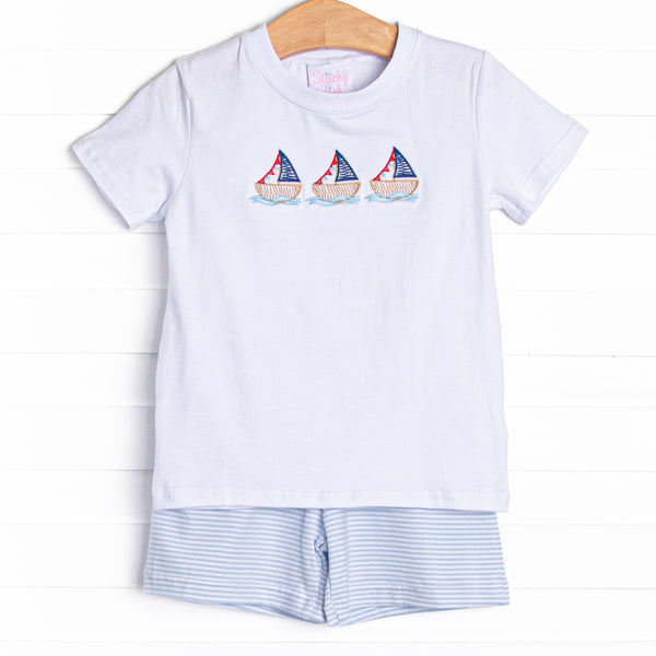  This set features a short sleeve top with a trio of sailboat embroidery and blue striped shorts to match. 