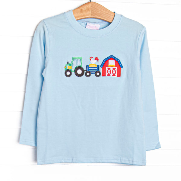  The top features a blue knit material, long sleeves, and&nbsp; barnyard appliques. 