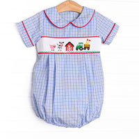 The bubble features a blue plaid print, peter pan collar, and farm smocking.