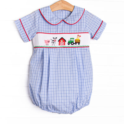 The bubble features a blue plaid print, peter pan collar, and farm smocking.