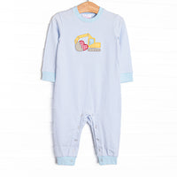  This romper features a blue striped print, an excavator applique, and snaps on the stride. 
